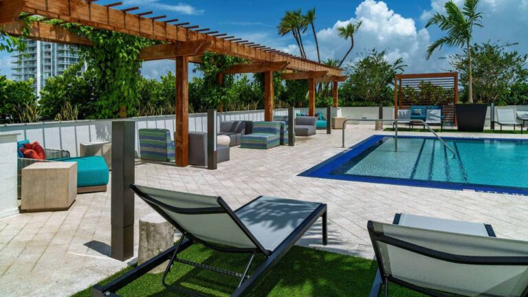 Swimming pool with sundeck and lounge chairs at a Tampa area apartment