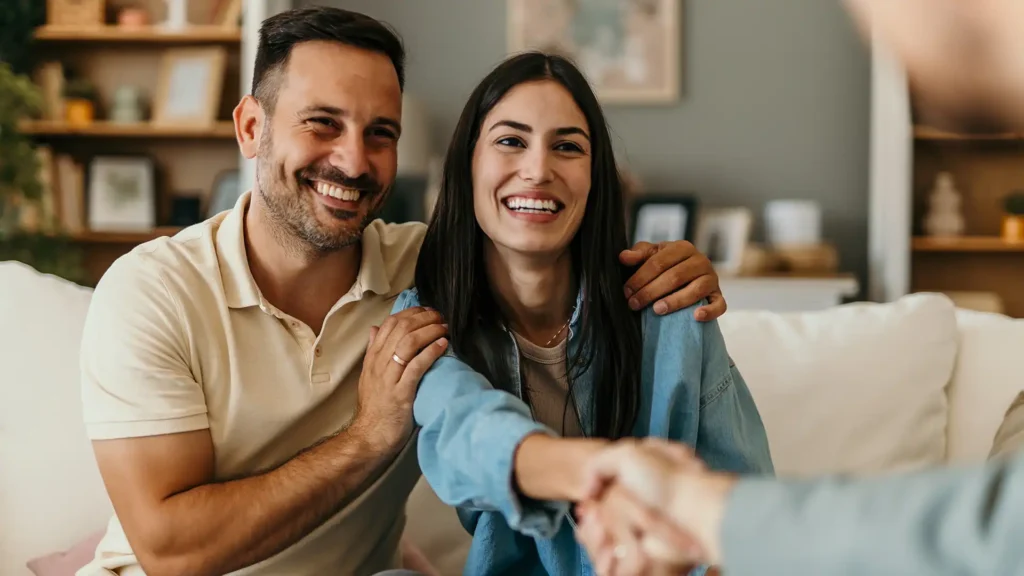 Happy man and woman clients handshake close deal or close the agreement with a real estate agent